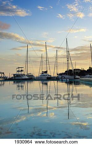 Sunset Over True Blue Bay Resort. Sail Boats Refelected In The Still Waters; Grenada, Caribbean View Large Photo Image Picture - Sunset Over True Blue Bay Resort. Sail Boats Refelected In The Still Waters; Grenada, Caribbean. Fotosearch