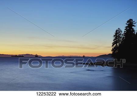 Sunset view over English Bay from Second Beach at Stanley Park; Vancouver, British Columbia, Canada View Large Photo Image Stock Image - Sunset view over English Bay from Second Beach at Stanley Park; Vancouver, British Columbia, Canada. Fotosearch