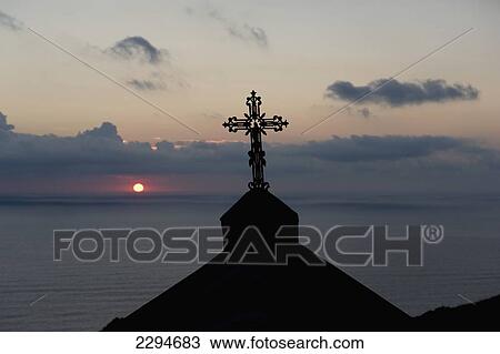 Stock Image - Sunset viewed from the village of Barrettali on the west coast of Cap Corse. Corsica. France. Fotosearch