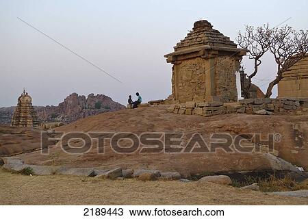 Sunset With Ruins On Hemakuta Hill In Hampi, Karnataka, India View Large Photo Image Stock Image - Sunset With Ruins On Hemakuta Hill In Hampi, Karnataka, India. Fotosearch
