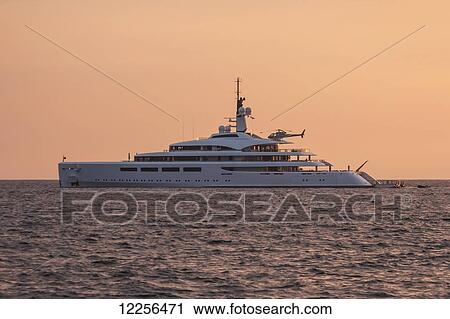 Stock Image - Super yacht Vava II at anchor in Kailua Bay; Kona, Island of Hawaii, Hawaii, United States of America. Fotosearch