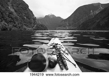 Supplies On The End Of A Kayak Going Through A Fjord; Doubtful Sound South Island New Zealand View Large Photo Image Stock Photo - Supplies On The End Of A Kayak Going Through A Fjord; Doubtful Sound South Island New Zealand. Fotosearch
