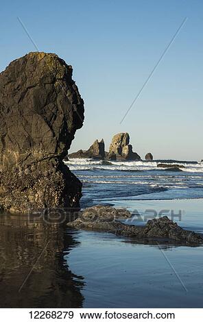 Stock Photo - Surf breaks on Crescent Beach; Cannon Beach, Oregon, United States of America. Fotosearch