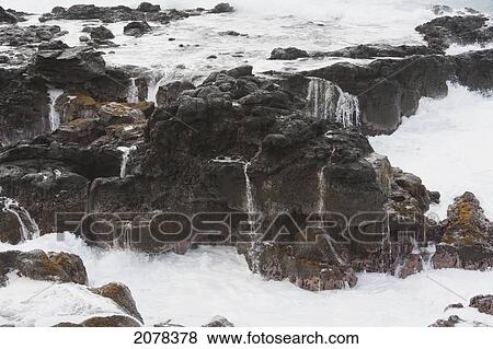 Stock Photo - Surf By The Volcanic Beach At Hanga Poukura, Rapa Nui (Easter Island), Chile. Fotosearch