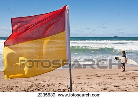 Surf Lifesaving Flag On Beach; New Zealand View Large Photo Image Stock Photo - Surf Lifesaving Flag On Beach; New Zealand. Fotosearch