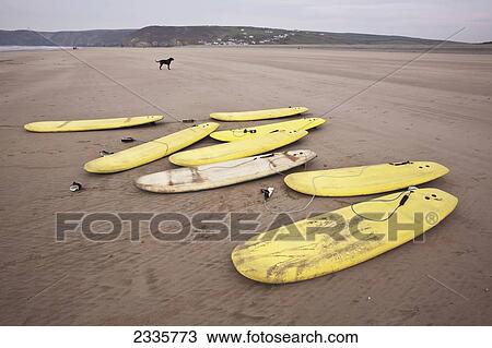 Surfboards On Newgale Beach; Pembrokeshire Coast Path, Wales, United Kingdom View Large Photo Image Stock Image - Surfboards On Newgale Beach; Pembrokeshire Coast Path, Wales, United Kingdom. Fotosearch