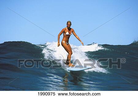 Stock Photography - Surfer Girl, Jessica Bishop Riding A Wave. Fotosearch