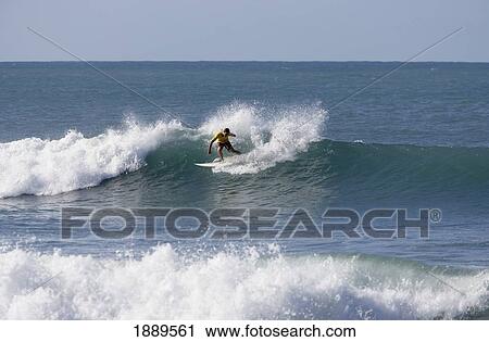 Stock Image - Surfer On Big Wave. Fotosearch