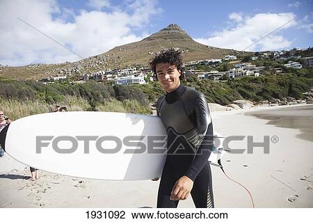 Surfer On The Beach In Mossel Bay, South Africa; Scenes, Surfing, In Llandudno, Cape Town, South Africa 
 View Large Photo Image Stock Image - Surfer On The Beach In Mossel Bay, South Africa; Scenes, Surfing, In Llandudno, Cape Town, South Africa 
. Fotosearch