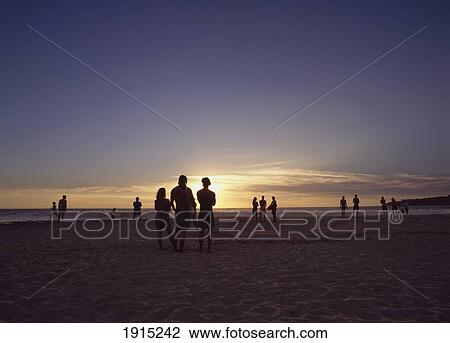 Surfers At Sunset View Large Photo Image Stock Image - Surfers At Sunset. Fotosearch