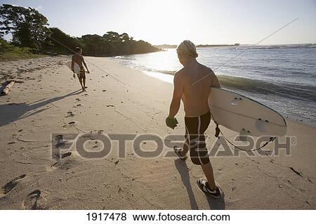 Surfers On The Beach View Large Photo Image Stock Photo - Surfers On The Beach. Fotosearch