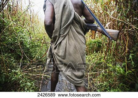 Suri man with AK47 assualt rifle, Omo region, Southwest Ethiopia; Kibish, Ethiopia View Large Photo Image Stock Photo - Suri man with AK47 assualt rifle, Omo region, Southwest Ethiopia; Kibish, Ethiopia. Fotosearch