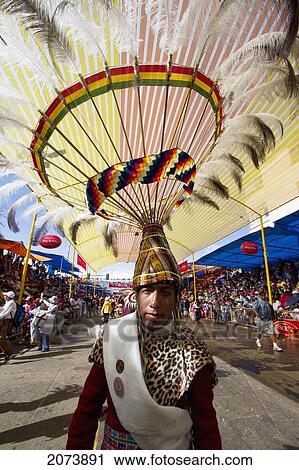Stock Image - Suri Sicuri Dancer Wearing An Elaborate Feather Headdress In The Procession Of The Carnaval De Oruro, Oruro, Bolivia. Fotosearch