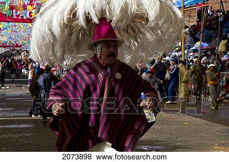 Suri Sicuri Dancer Wearing An Elaborate Feather Headdress In The Procession Of The Carnaval De Oruro, Oruro, Bolivia View Large Photo Image Stock Photo - Suri Sicuri Dancer Wearing An Elaborate Feather Headdress In The Procession Of The Carnaval De Oruro, Oruro, Bolivia. Fotosearch