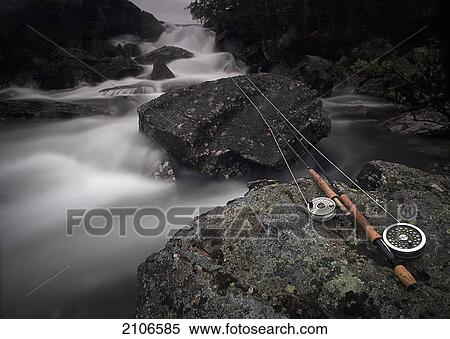 Sweden, Lapland, Fishing rod on rock by river; Miekak View Large Photo Image Stock Photography - Sweden, Lapland, Fishing rod on rock by river; Miekak. Fotosearch