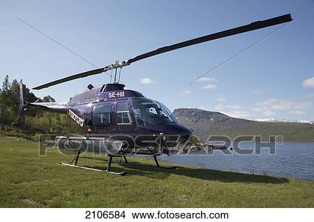 Picture - Sweden, Lappland, Helicopter transfer for fly fishing trip; Stora Sjofallet National Park. Fotosearch