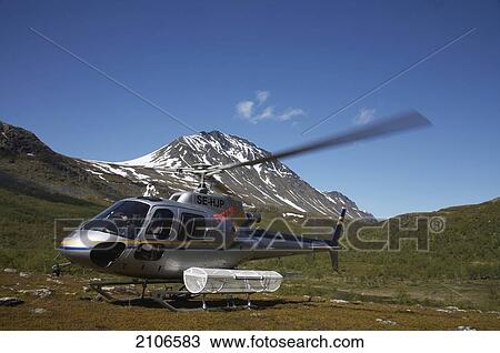 Stock Image - Sweden, Lappland, Helicopter transfer for fly fishing trip to Stora Sjofallet National Park. Fotosearch