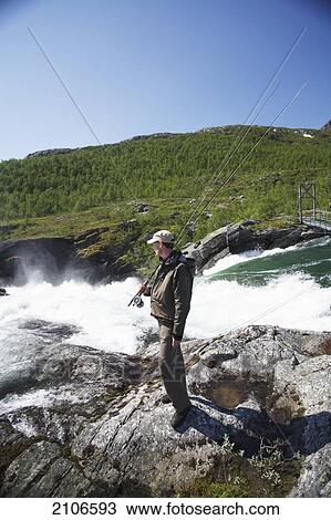 Sweden, Man fly fishing; Miekak Lapland View Large Photo Image Stock Image - Sweden, Man fly fishing; Miekak Lapland. Fotosearch
