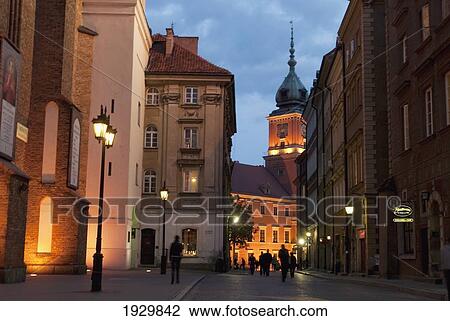 Swietojanska Street towards the Royal Castle at dusk in the UNESCO World Heritage Site Old Town district of Warsaw, Poland View Large Photo Image Stock Image - Swietojanska Street towards the Royal Castle at dusk in the UNESCO World Heritage Site Old Town district of Warsaw, Poland. Fotosearch
