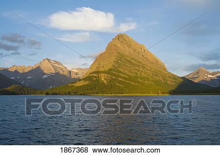 Swiftcurrent Lake, Grinnell Point, Glacier National Park, Montana, Usa View Large Photo Image Stock Photo - Swiftcurrent Lake, Grinnell Point, Glacier National Park, Montana, Usa. Fotosearch