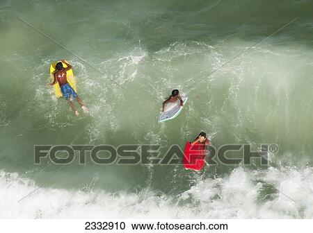 Swimmers On Bodyboards In The Water Off Ipanema Beach; Rio De Janeiro, Brazil View Large Photo Image Stock Image - Swimmers On Bodyboards In The Water Off Ipanema Beach; Rio De Janeiro, Brazil. Fotosearch