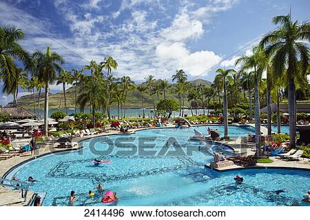 Stock Photograph - Swimming pool at a resort along the coast; Kauai, Hawaii, United States of America. Fotosearch