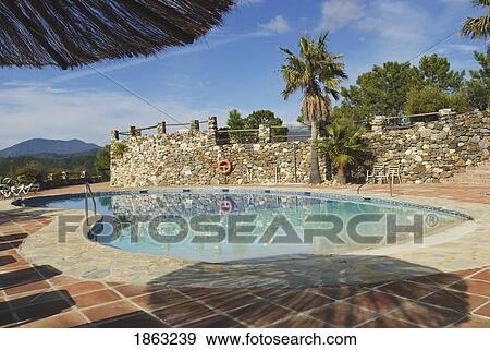 Stock Photo - Swimming Pool, Malaga, Andalucia, Spain. Fotosearch