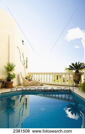 Swimming pool with reflected sky and clouds at a villa; Nerja, Andalucia, Spain View Large Photo Image Stock Photo - Swimming pool with reflected sky and clouds at a villa; Nerja, Andalucia, Spain. Fotosearch