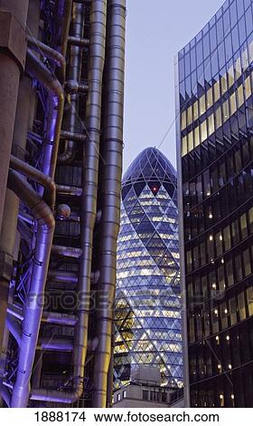 Picture - Swiss Re Building Seen Through Lloyds Building And Nearby Office Building. Fotosearch