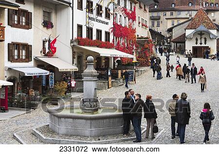 Stock Image - Switzerland, Town square; Gruyeres. Fotosearch