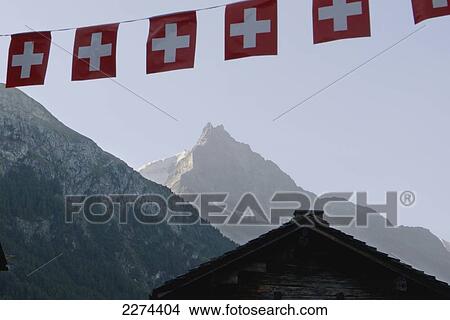 Picture - Switzerland, Val d'Anniviers, 675 m in the Swiss Alps. Typical wooden Swiss chalets; Zinal, Small mountain resort that lies at an altitude of 1. Fotosearch