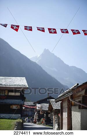 Switzerland, Val d'Anniviers, 675 m in the Swiss Alps. Typical wooden Swiss chalets; Zinal, Small mountain resort that lies at an altitude of 1 View Large Photo Image Stock Image - Switzerland, Val d'Anniviers, 675 m in the Swiss Alps. Typical wooden Swiss chalets; Zinal, Small mountain resort that lies at an altitude of 1. Fotosearch