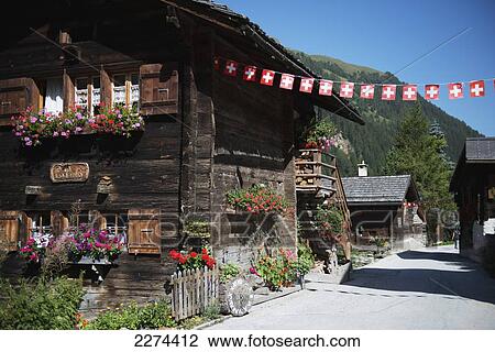 Stock Image - Switzerland, Val d'Anniviers, 675 m in the Swiss Alps. Typical wooden Swiss chalets; Zinal, Small mountain resort that lies at an altitude of 1. Fotosearch