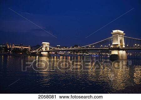 Stock Image - Szechenyi Chain Bridge Over The Danube River At Night, Budapest, Hungary. Fotosearch