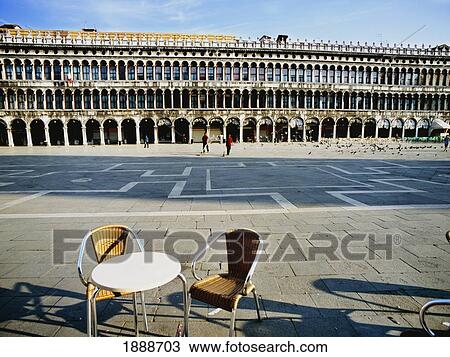 Stock Image - Table And Chair In Piazza San Marco. Fotosearch