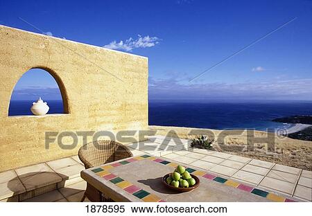 Table And Chair On Patio Overlooking Coastline View Large Photo Image Stock Photography - Table And Chair On Patio Overlooking Coastline. Fotosearch
