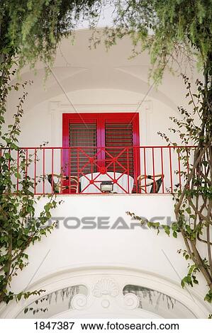 Stock Photo - Table And Chairs On Balcony; Capri, Italy. Fotosearch