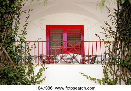 Stock Photograph - Table And Chairs On Balcony; Capri, Italy. Fotosearch