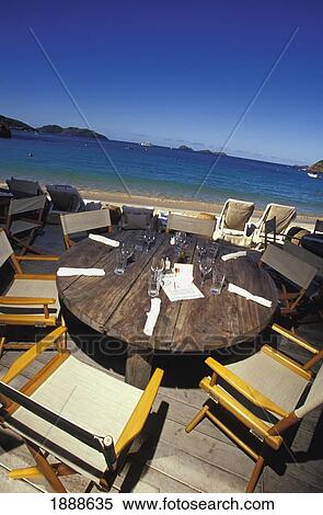 Table And Chairs On Beachfront Patio On Nikki Beach View Large Photo Image Stock Photography - Table And Chairs On Beachfront Patio On Nikki Beach. Fotosearch