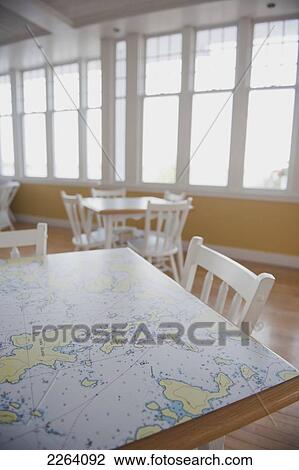 Stock Image - Table With Map Surface Inside The Royal Lake Of The Woods Yacht Club; Kenora Ontario Canada. Fotosearch