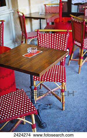 Tables and woven chairs in red and white, Marais district; Paris, France View Large Photo Image Picture - Tables and woven chairs in red and white, Marais district; Paris, France. Fotosearch