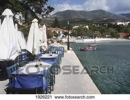 Stock Image - Tables By The Waterfront. Fotosearch
