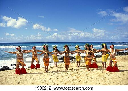 Stock Image - Tahitian Dance Troupe, Men And Women Performing On Beach. Fotosearch