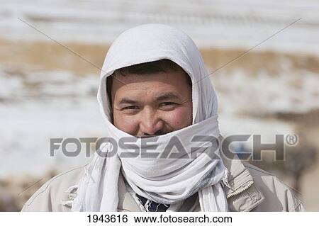 Stock Photograph - Tajik Man At The Hajigak Pass, Vardak Province, Afghanistan. Fotosearch