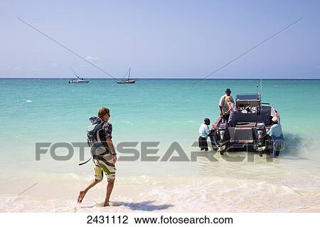 Taking a motorboat out into the turquoise ocean; Vamizi Island, Mozambique View Large Photo Image Stock Image - Taking a motorboat out into the turquoise ocean; Vamizi Island, Mozambique. Fotosearch