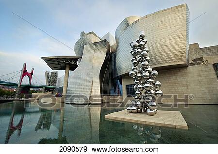 Tall Tree Sculpture In Front Of Guggenheim Museum, Bilbao, Basque Country, Spain View Large Photo Image Stock Photo - Tall Tree Sculpture In Front Of Guggenheim Museum, Bilbao, Basque Country, Spain. Fotosearch