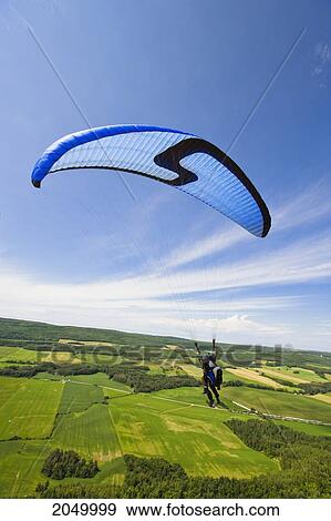 Tandem Paragliding Over Fields, Bas-Saint-Laurent Region, Saint-Anaclet, Quebec View Large Photo Image Stock Photo - Tandem Paragliding Over Fields, Bas-Saint-Laurent Region, Saint-Anaclet, Quebec. Fotosearch