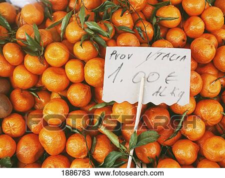 Stock Image - Tangerines For Sale In Market. Fotosearch
