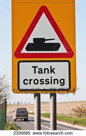 Stock Photography - Tank Crossing Road Sign On Salisbury Plain, Along A360 Road Near Tilshead Village; Wiltshire, England, Uk. Fotosearch