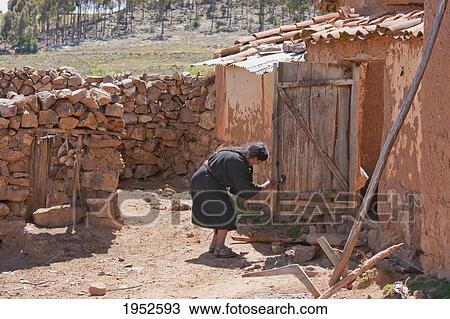 Tarabuco woman by her adobe house, Jatun Yampara Indigenous Community, Chuquisaca Department, Bolivia View Large Photo Image Stock Image - Tarabuco woman by her adobe house, Jatun Yampara Indigenous Community, Chuquisaca Department, Bolivia. Fotosearch